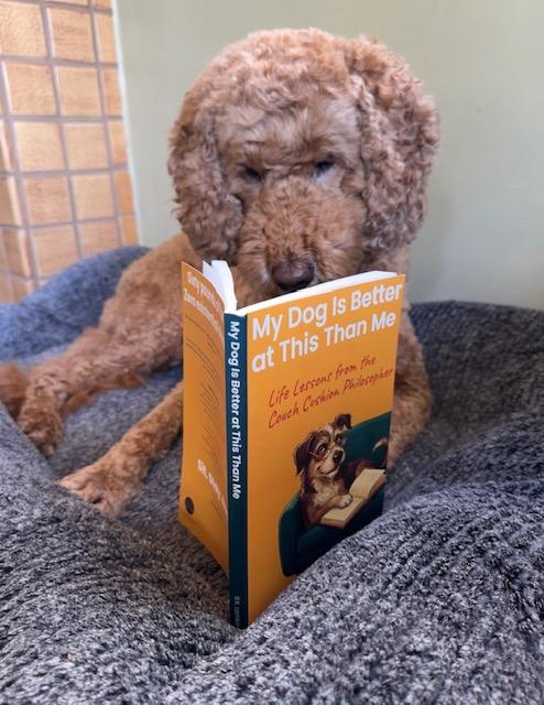 Bernie reading My Dog Is Better at This Than Me